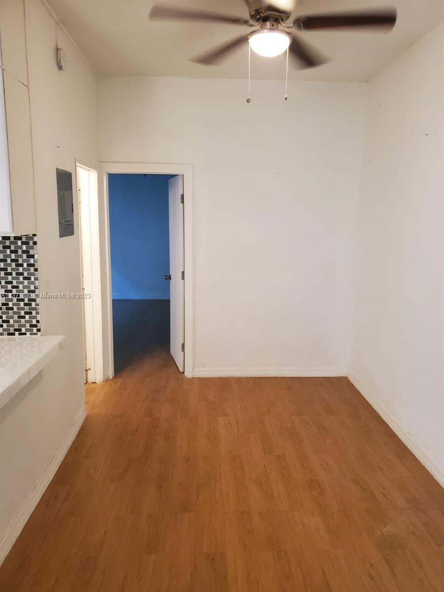 7149 Bay Drive, Unit 2 Miami Beach, FL 33141 - Photo 4 of 15 a view of an empty room with a chandelier fan