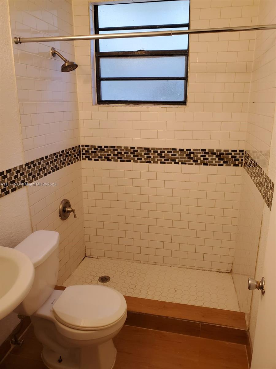 7149 Bay Drive, Unit 2 Miami Beach, FL 33141 - Photo 9 of 15 a bathroom with a toilet and a shower