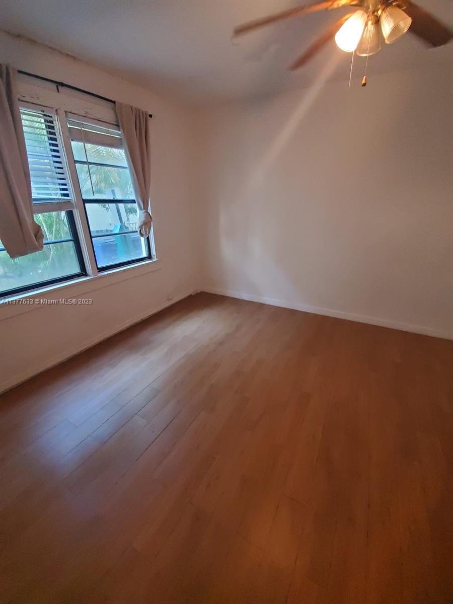 7149 Bay Drive, Unit 2 Miami Beach, FL 33141 - Photo 10 of 15 an empty room with a window