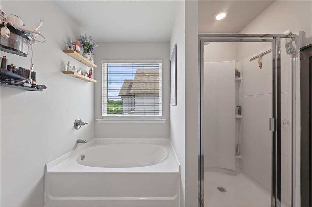266 Shoals Bridge Road Acworth, GA 30102 - Photo 26 of 43 a bathroom with a tub and shower