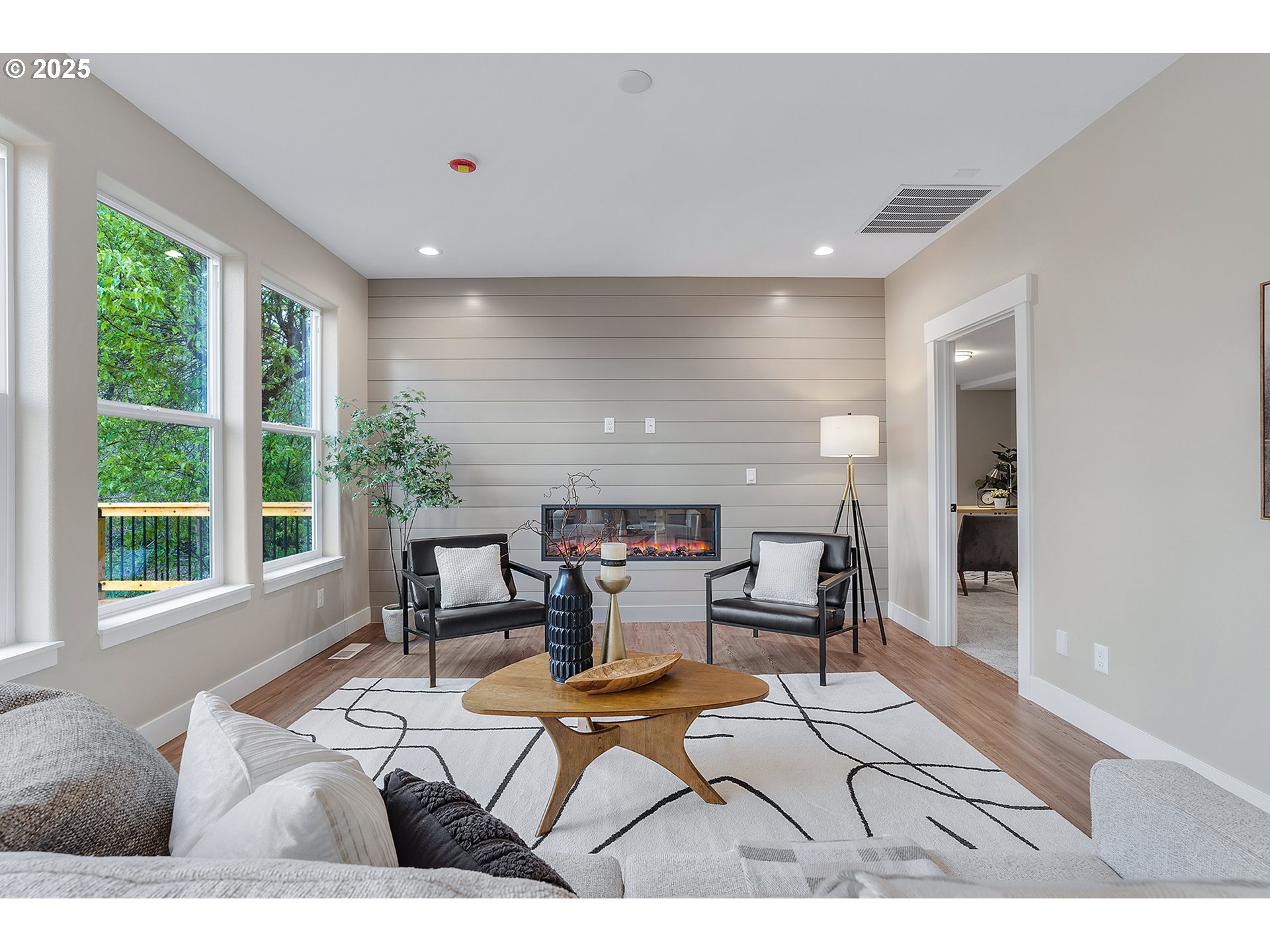 655 Barbary Place Gladstone, OR 97027 - Photo 16 of 48 a living room with furniture and large windows