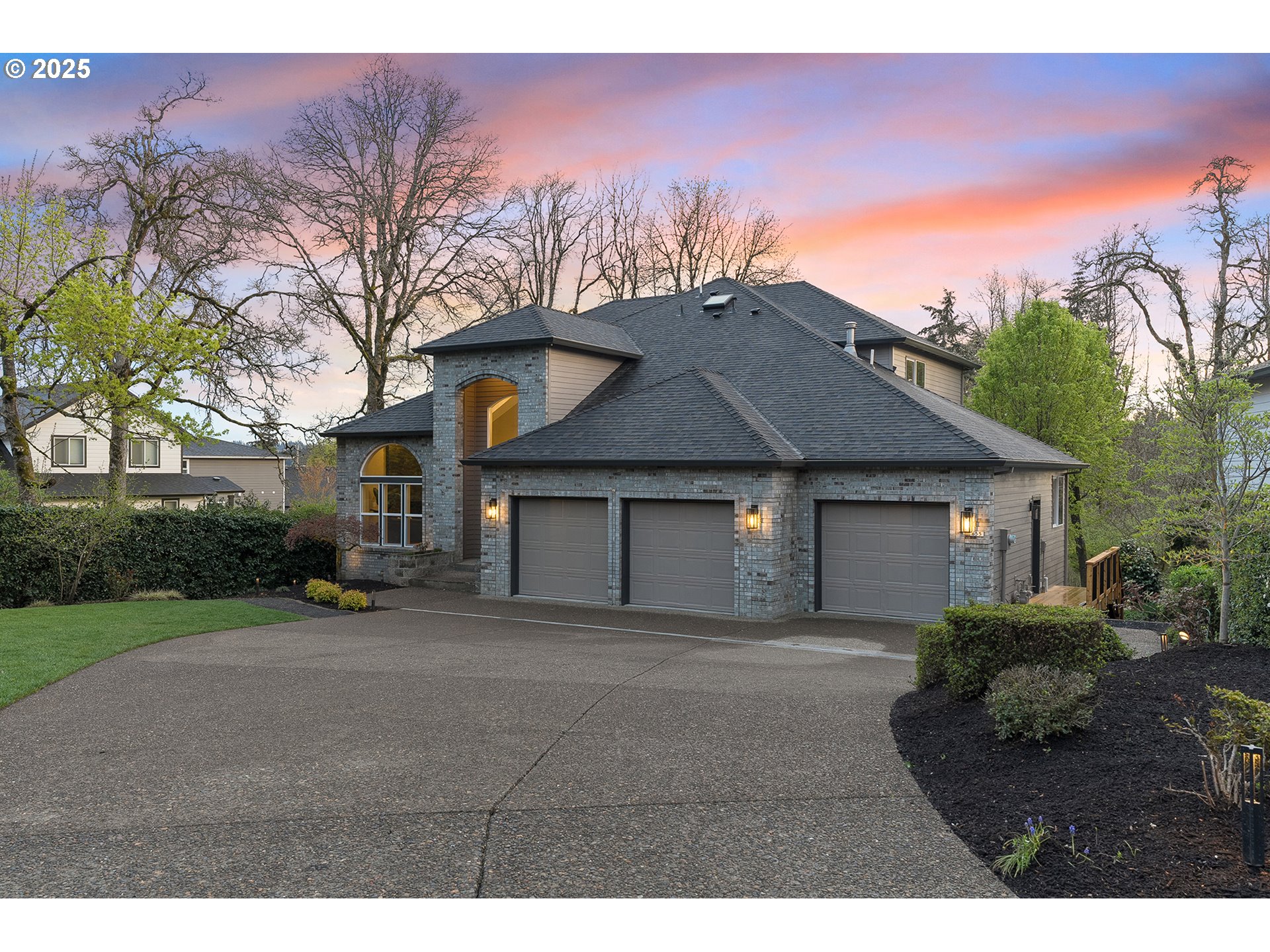 655 Barbary Place Gladstone, OR 97027 - Photo 2 of 48 a front view of a house with a yard and garage