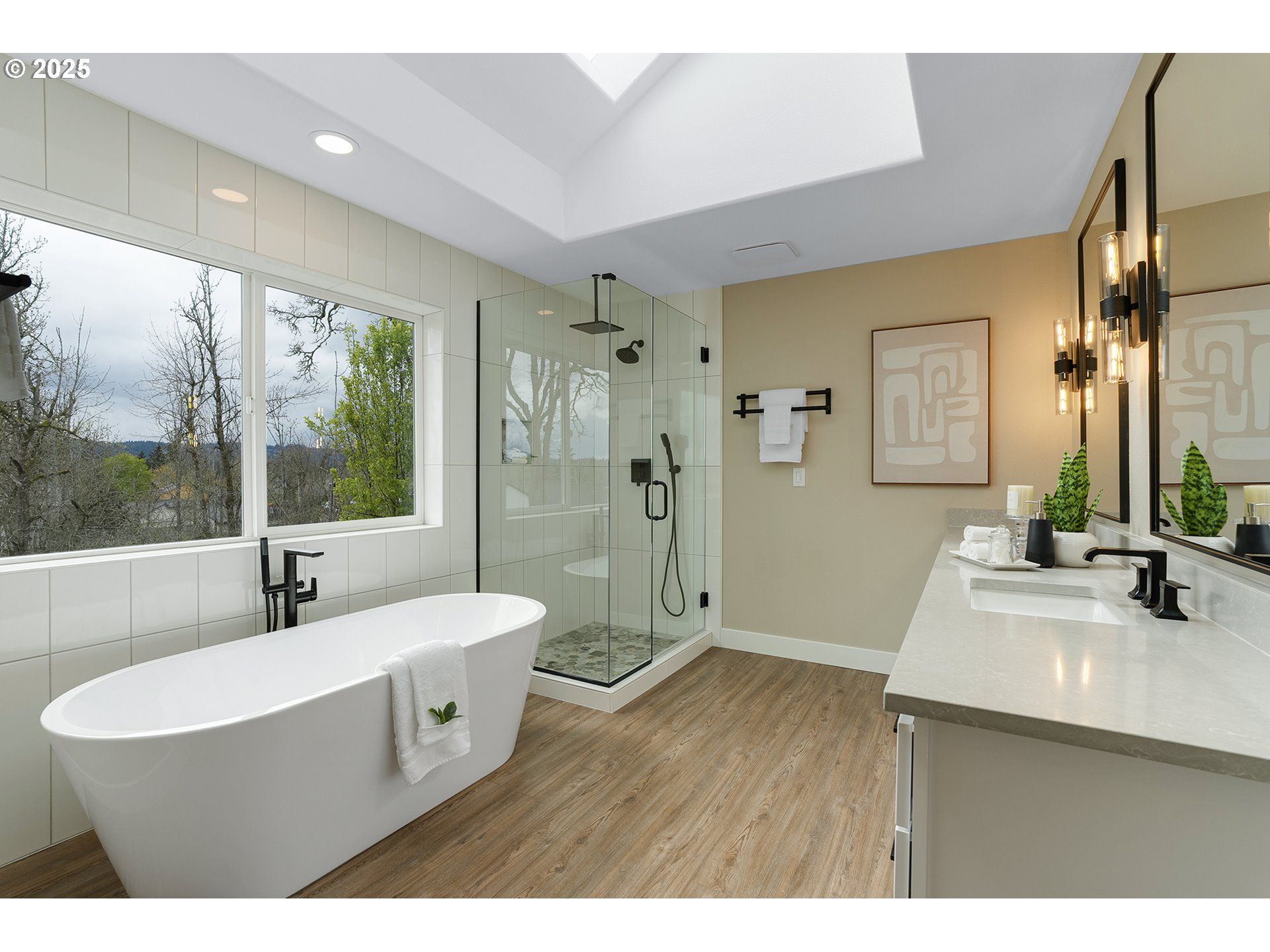 655 Barbary Place Gladstone, OR 97027 - Photo 23 of 48 a bathroom with a double vanity sink a mirror and a bathtub