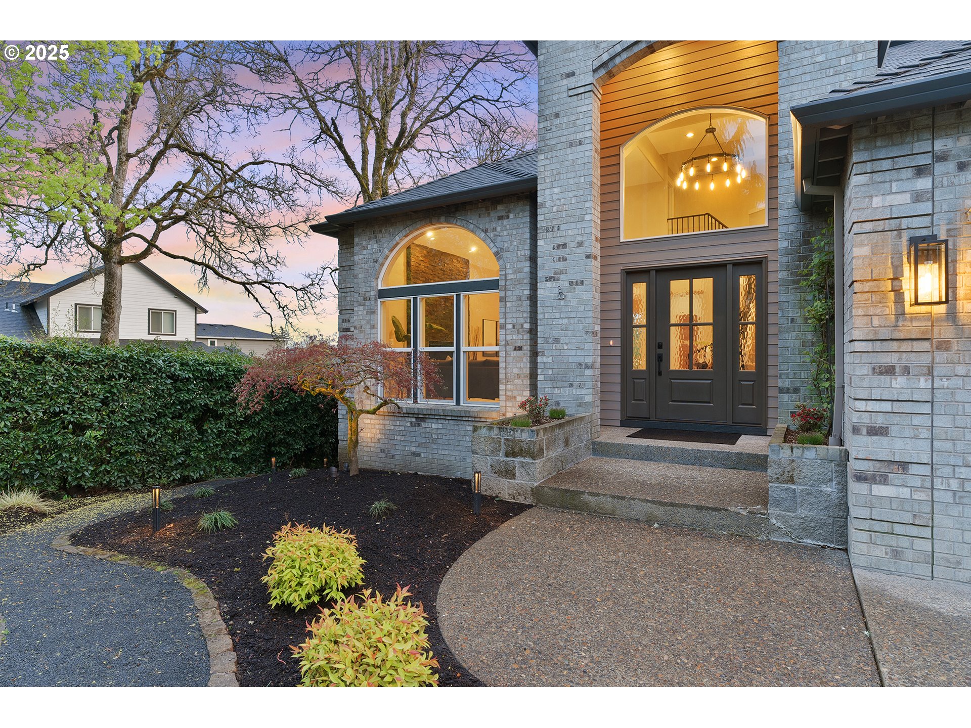 655 Barbary Place Gladstone, OR 97027 - Photo 3 of 48 a view of a brick house with a large windows