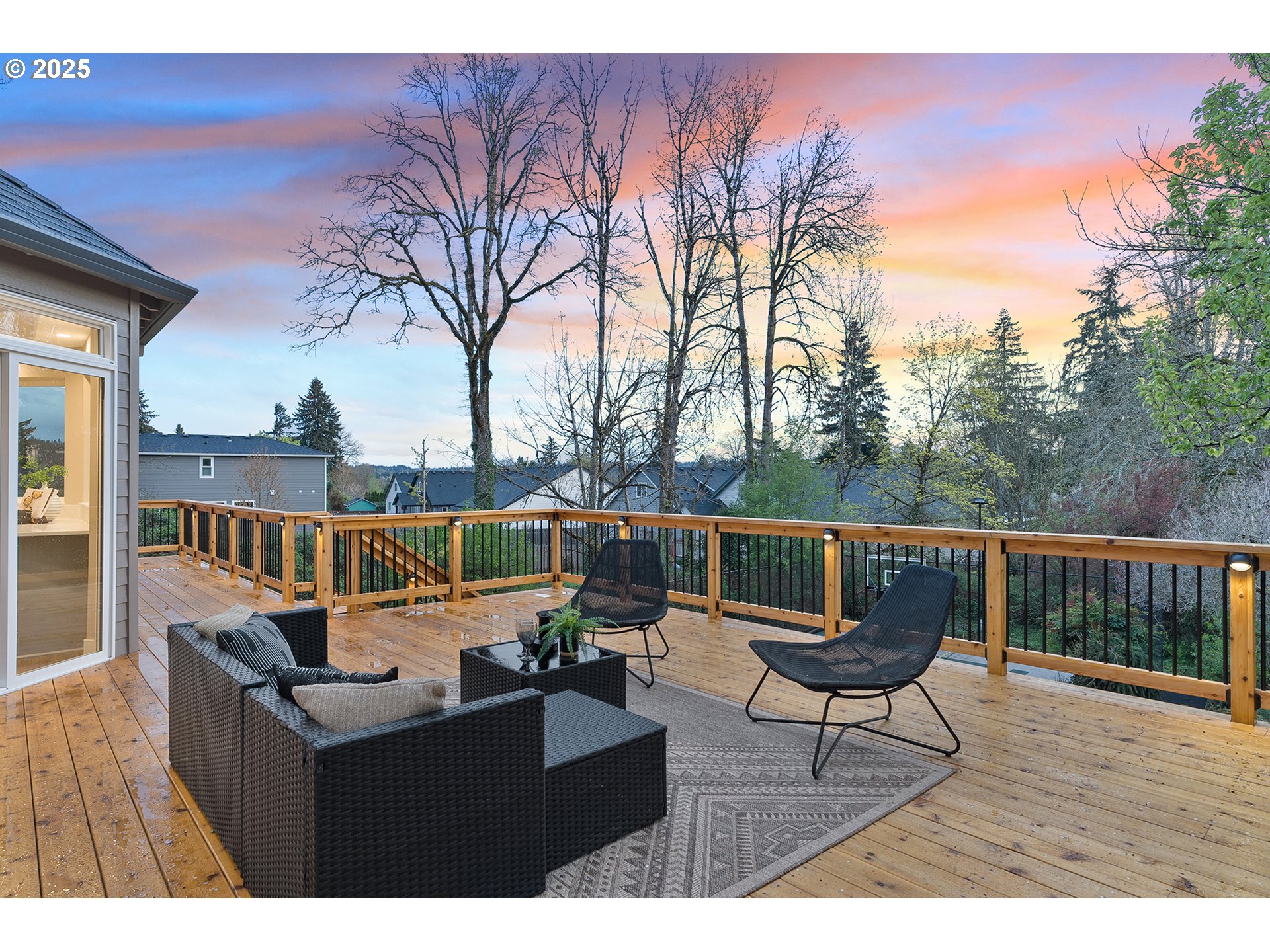 655 Barbary Place Gladstone, OR 97027 - Photo 37 of 48 a balcony with wooden floor table and chairs