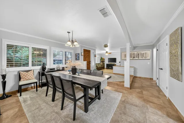 a kitchen with stainless steel appliances granite countertop wooden cabinets a sink and dishwasher a oven with wooden cabinets