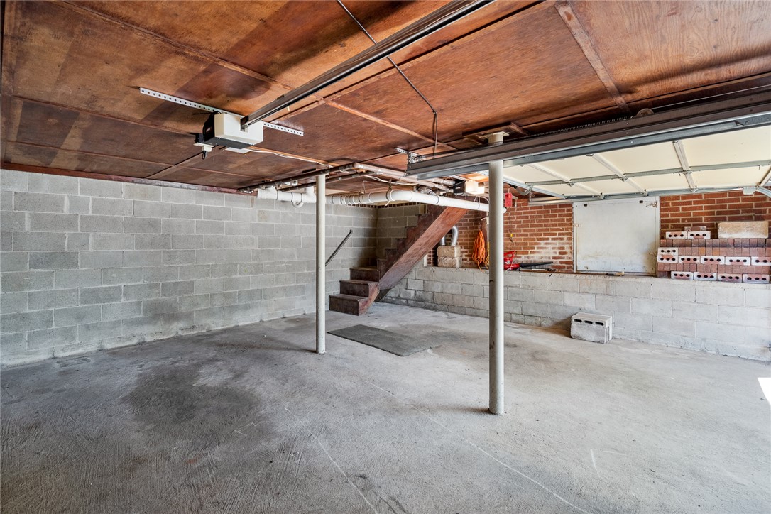1509 869 Anderson, SC 29621 - Photo 33 of 45 A spacious, unfinished basement offers versatile storage or future expansion possibilities.