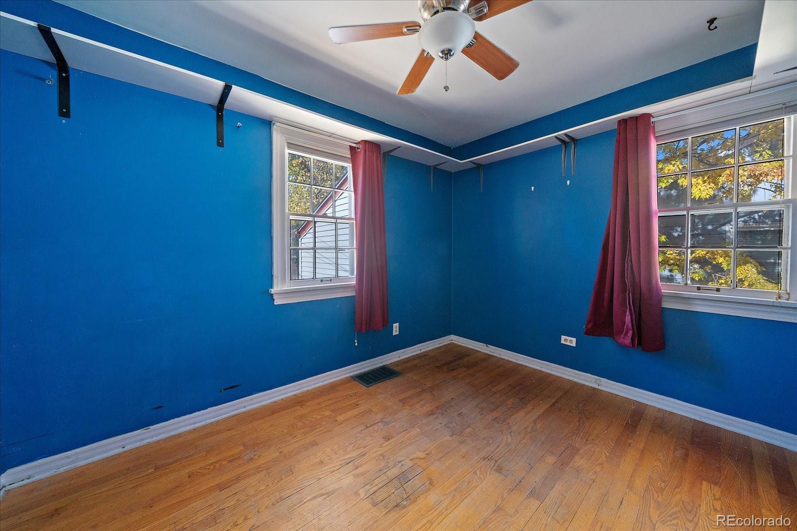 2575 South Lafayette Street Denver, CO 80210 - Photo 11 of 25 a view of empty room with window and ceiling fan