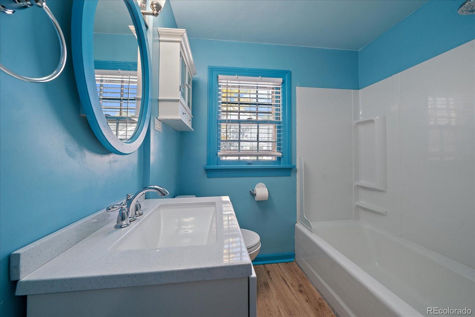 2575 South Lafayette Street Denver, CO 80210 - Photo 13 of 25 a bathroom with a sink a toilet and a bathtub
