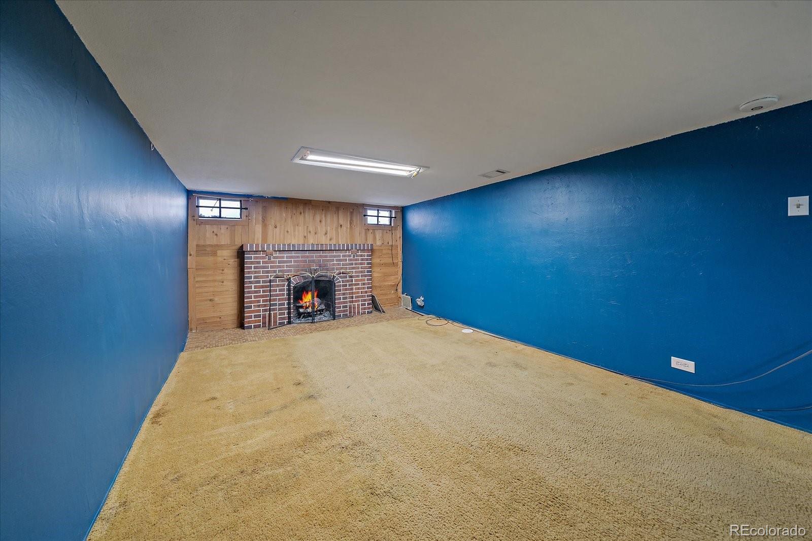 2575 South Lafayette Street Denver, CO 80210 - Photo 15 of 25 a view of an empty room with a fireplace