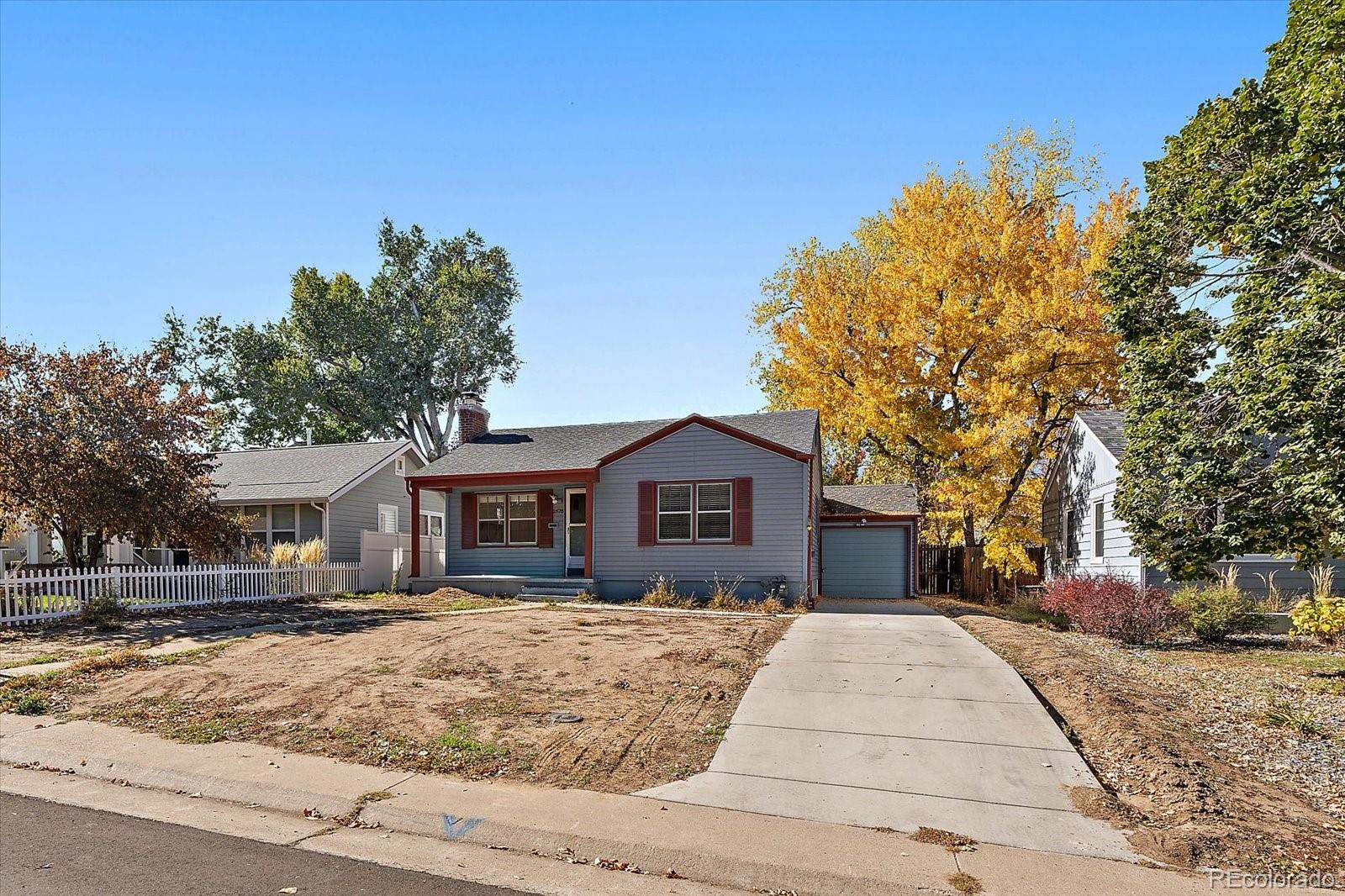 2575 South Lafayette Street Denver, CO 80210 - Photo 2 of 25 a front view of a house with a yard