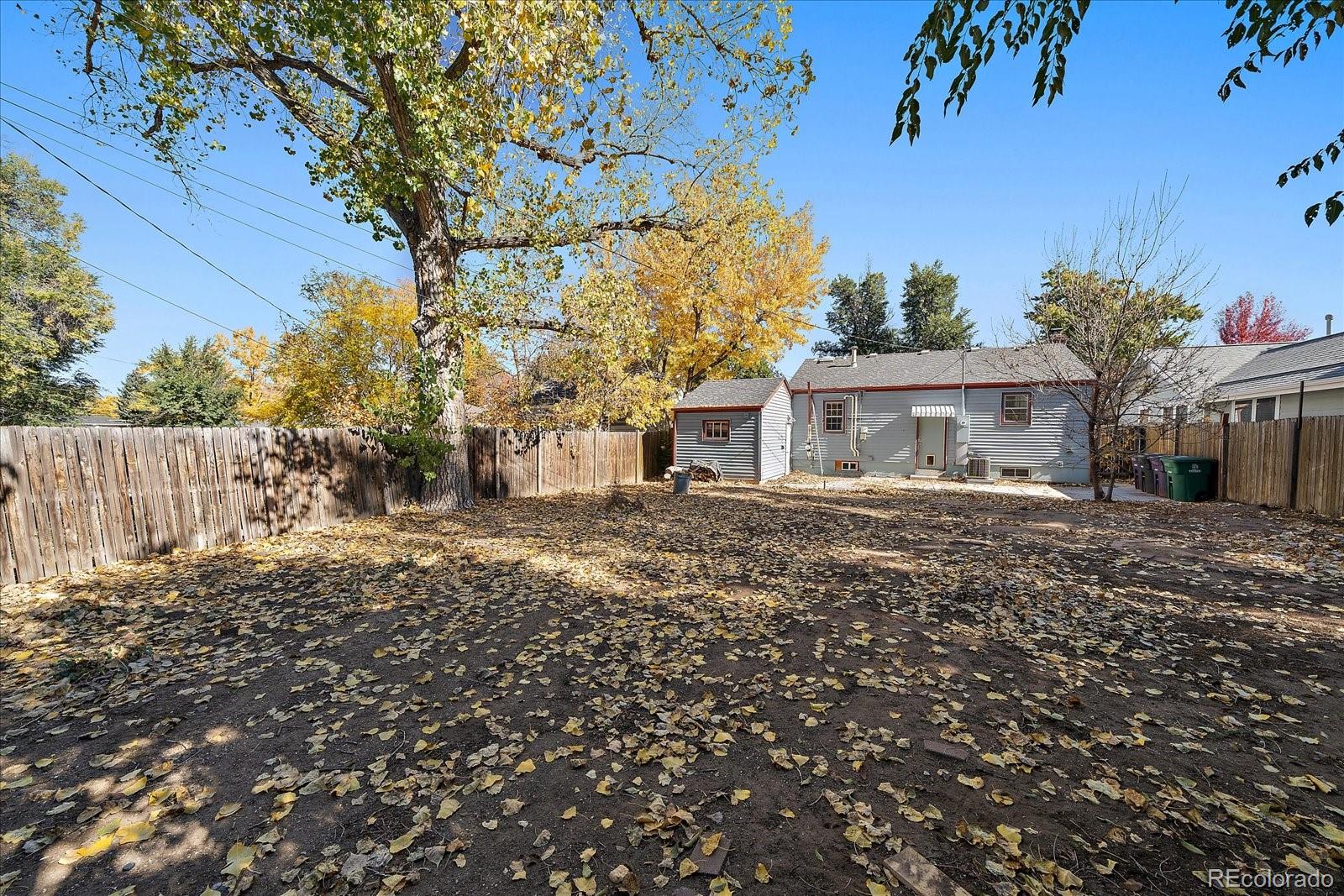 2575 South Lafayette Street Denver, CO 80210 - Photo 24 of 25 a front view of a house with a garden