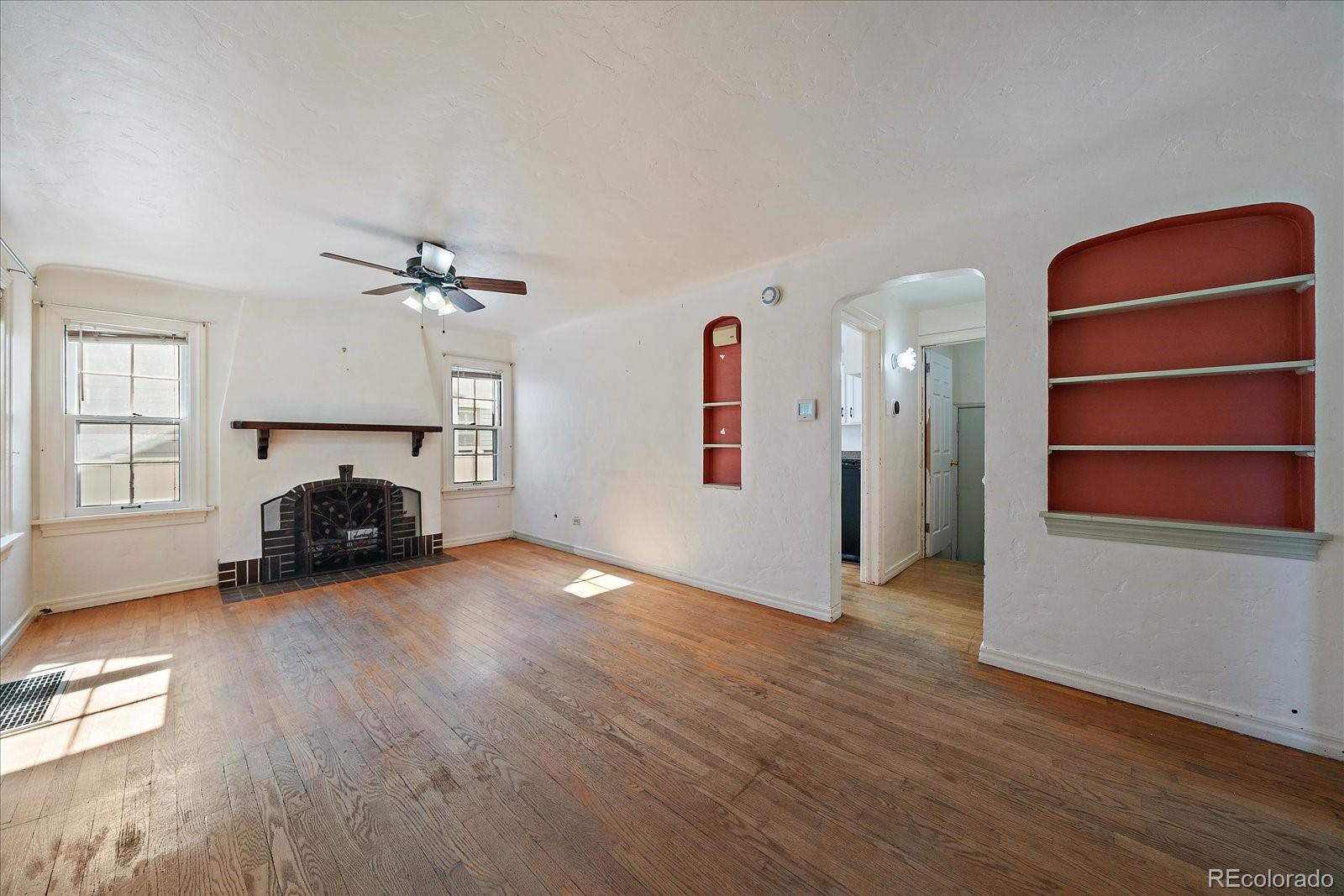 2575 South Lafayette Street Denver, CO 80210 - Photo 3 of 25 a view of a livingroom with furniture and a fireplace