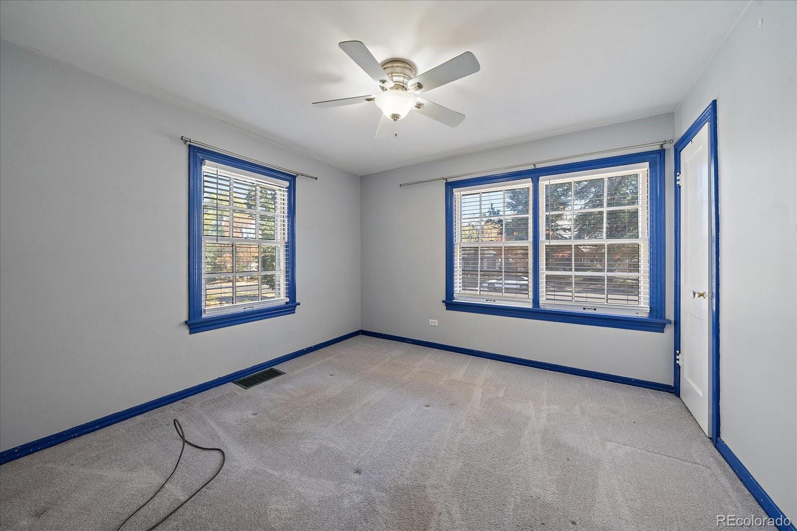 2575 South Lafayette Street Denver, CO 80210 - Photo 9 of 25 a view of an empty room with a window