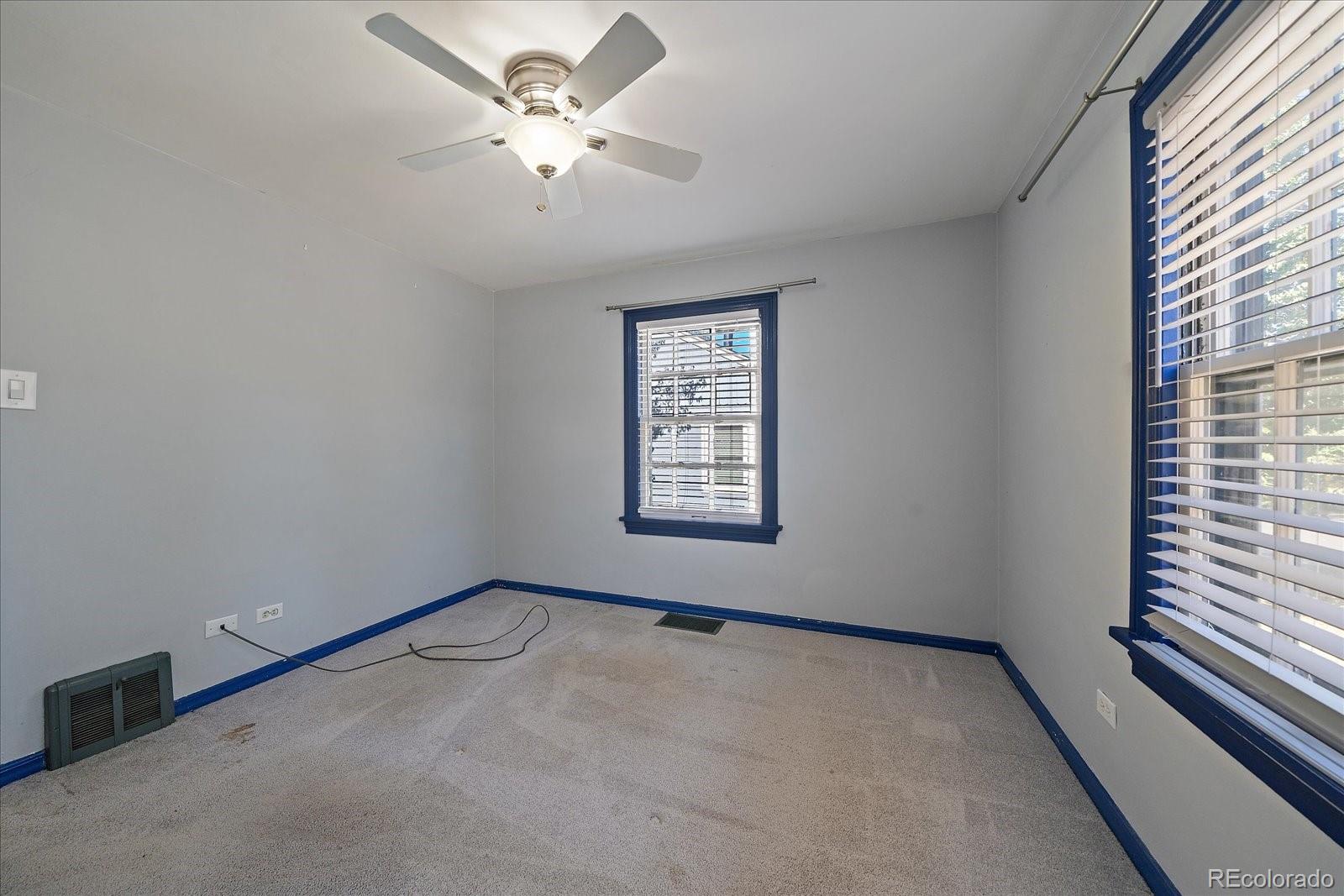 2575 South Lafayette Street Denver, CO 80210 - Photo 10 of 25 a view of an empty room with a window