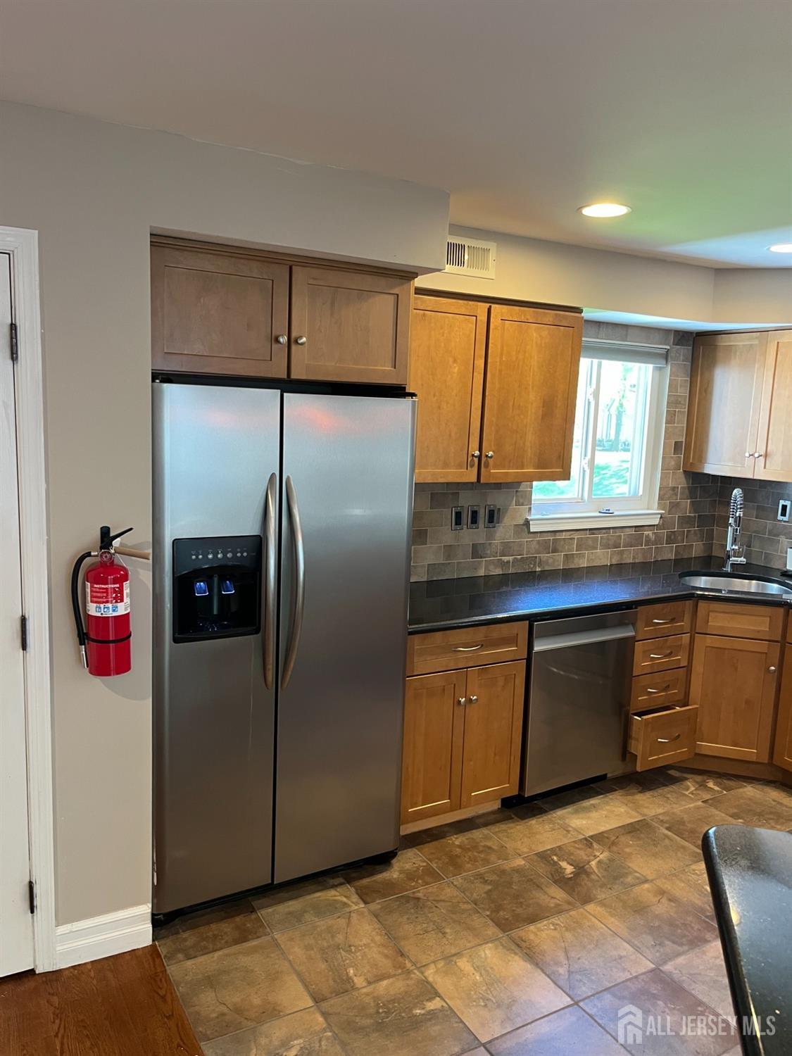 511 Chanticleer Cherry Hill, NJ 08003 - Photo 8 of 20 a kitchen with stainless steel appliances granite countertop a refrigerator and a sink