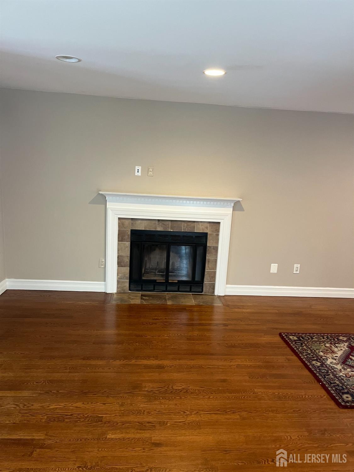 511 Chanticleer Cherry Hill, NJ 08003 - Photo 9 of 20 a view of empty room with wooden floor and fireplace