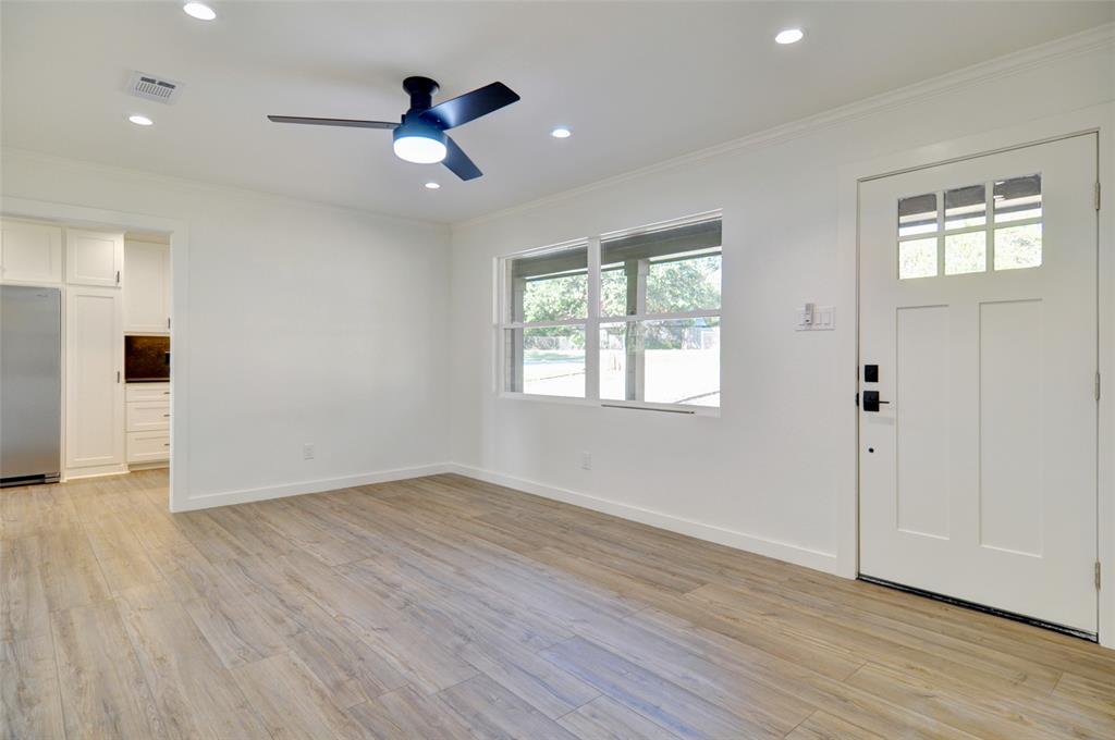 5549 Sam Calloway Road Fort Worth, TX 76114 - Photo 7 of 31 an empty room with wooden floor and windows