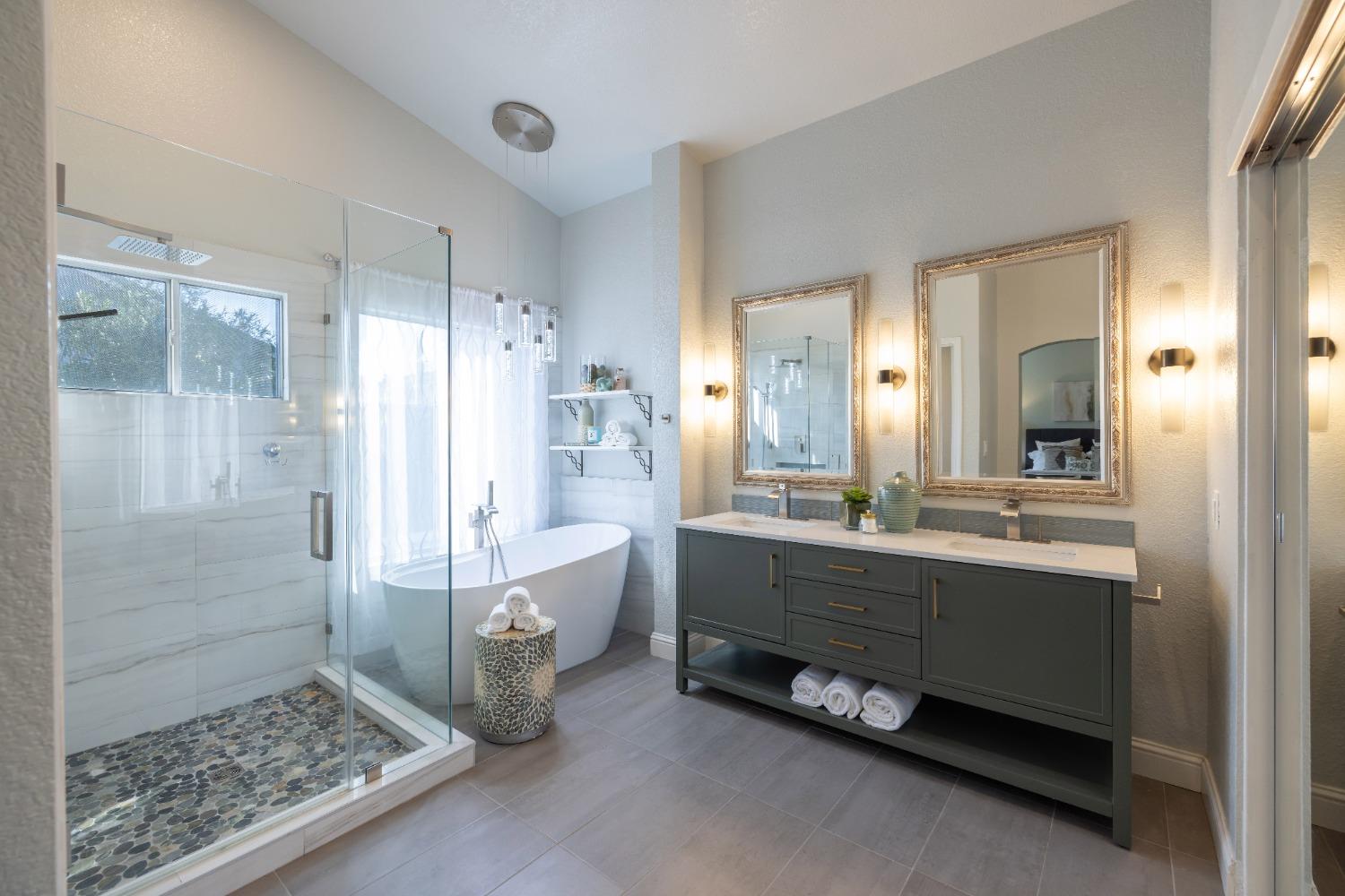 3107 Strand Road Rocklin, CA 95765 - Photo 1 of 1 a bathroom with double vanity and a bathtub