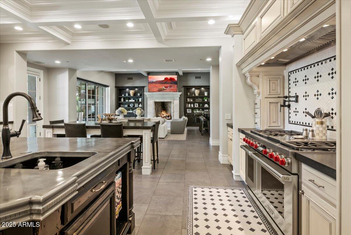 2205 East Colter Street Phoenix, AZ 85016 - Photo 13 of 59 a kitchen with stainless steel appliances granite countertop a sink a stove and a refrigerator