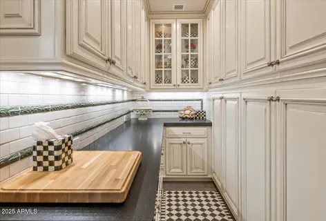 a kitchen with stainless steel appliances granite countertop a sink a stove and a refrigerator