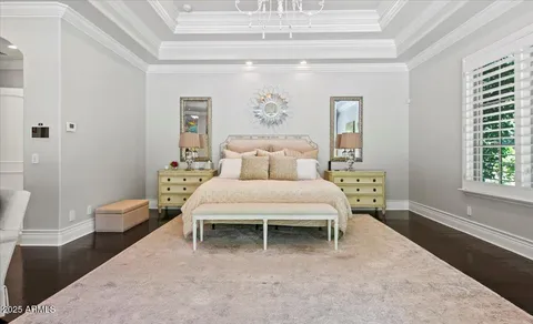a spacious bathroom with a tub sink and mirror