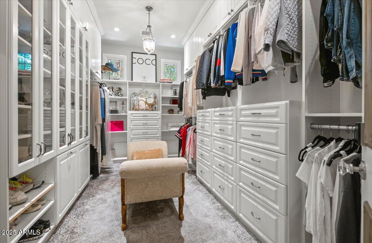 2205 East Colter Street Phoenix, AZ 85016 - Photo 24 of 59 a view of walk in closet with clothes and shoes