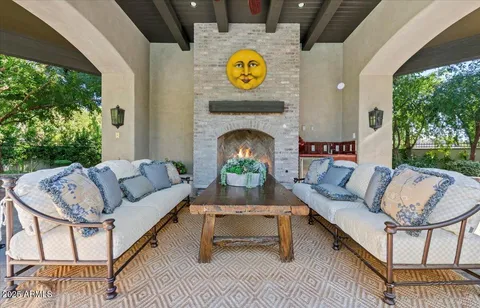 a view of a swimming pool with a patio and plants