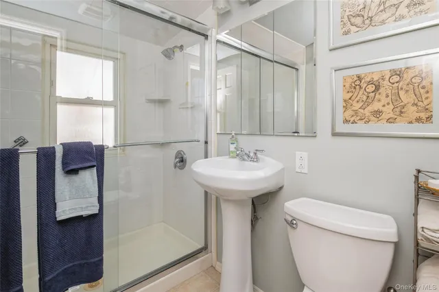 a bedroom with furniture and a mirror