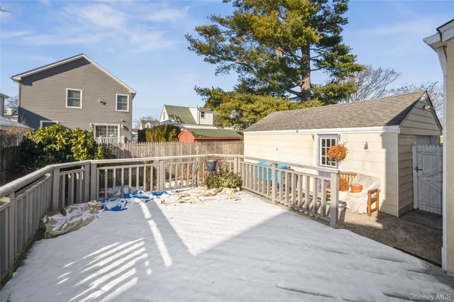 a view of a deck with wooden floor and fence
