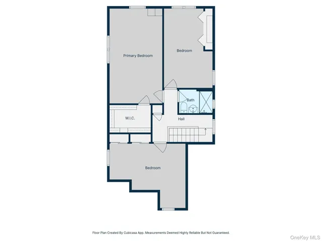 a picture of a room with a white wall and a refrigerator