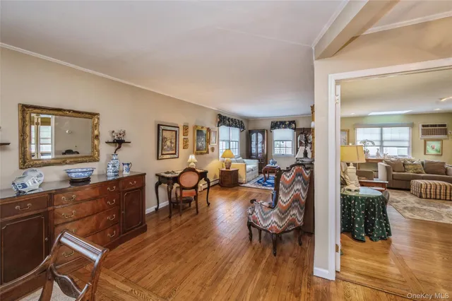 a view of a dining room with furniture window and wooden floor