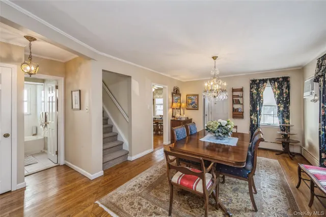 a living room with fireplace furniture and wooden floor