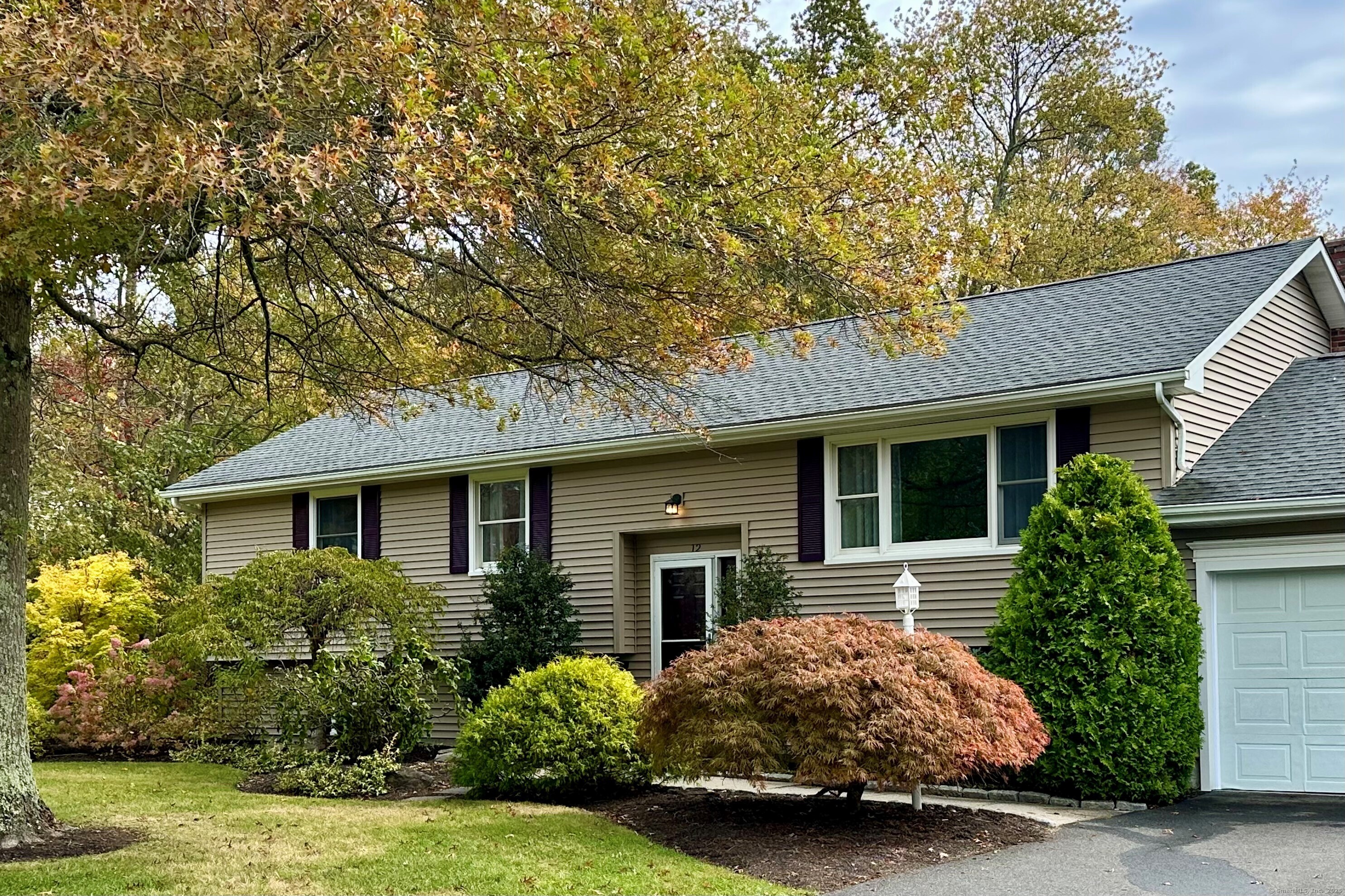 12 Round Table Road New Milford, CT 06776 - Photo 1 of 1 a front view of a house with garden