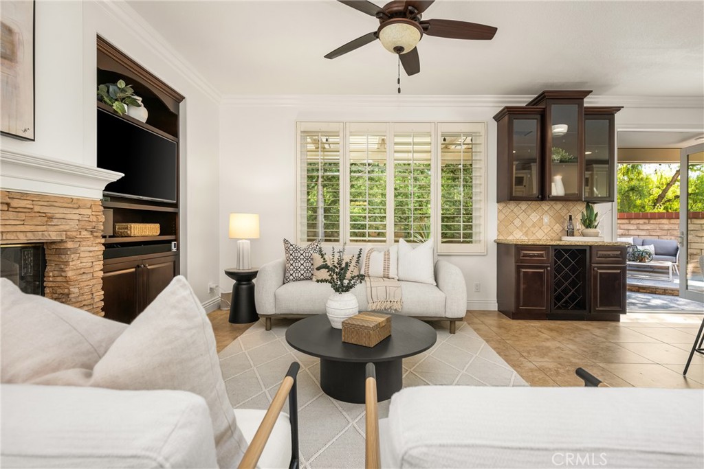 10970 Hiskey Lane Tustin, CA 92782 - Photo 17 of 60 a living room with furniture fireplace and a large window