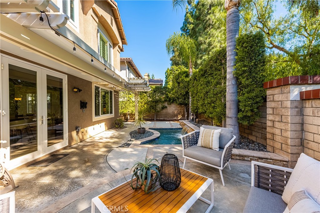 10970 Hiskey Lane Tustin, CA 92782 - Photo 31 of 60 a view of a patio with couches table and chairs and potted plants