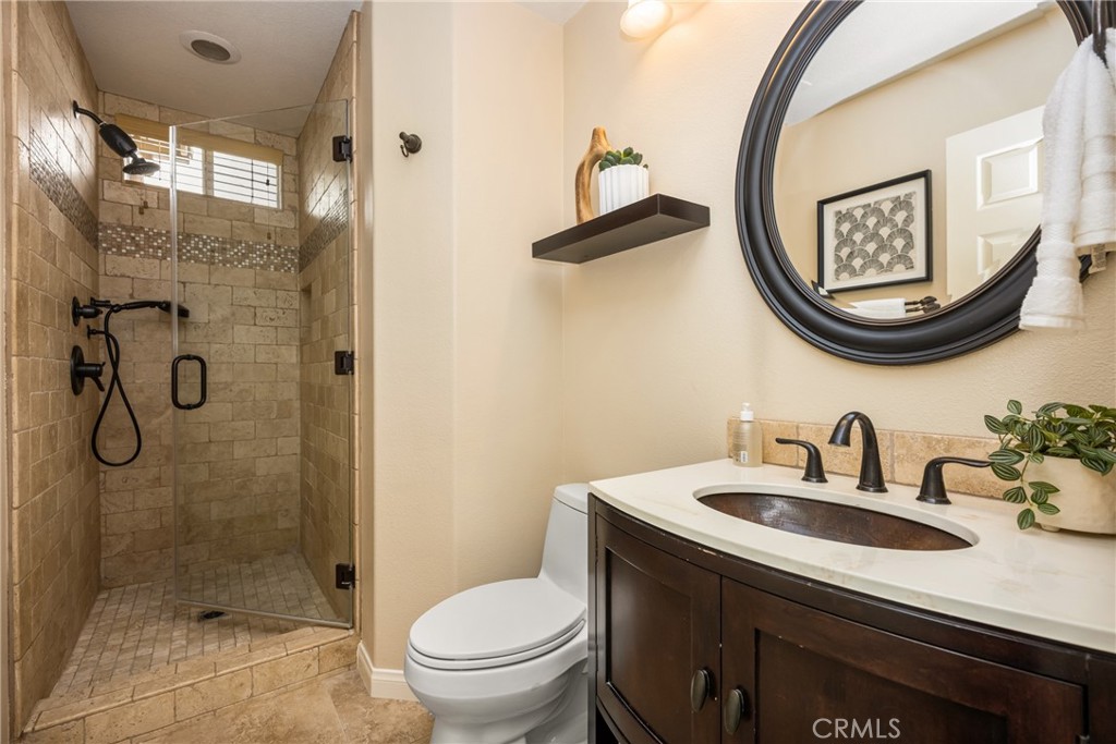 10970 Hiskey Lane Tustin, CA 92782 - Photo 36 of 60 a bathroom with a sink and a mirror
