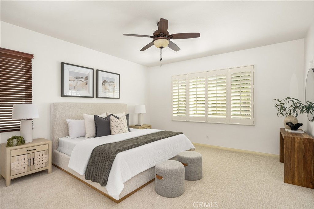 10970 Hiskey Lane Tustin, CA 92782 - Photo 40 of 60 a spacious bedroom with a bed and a window