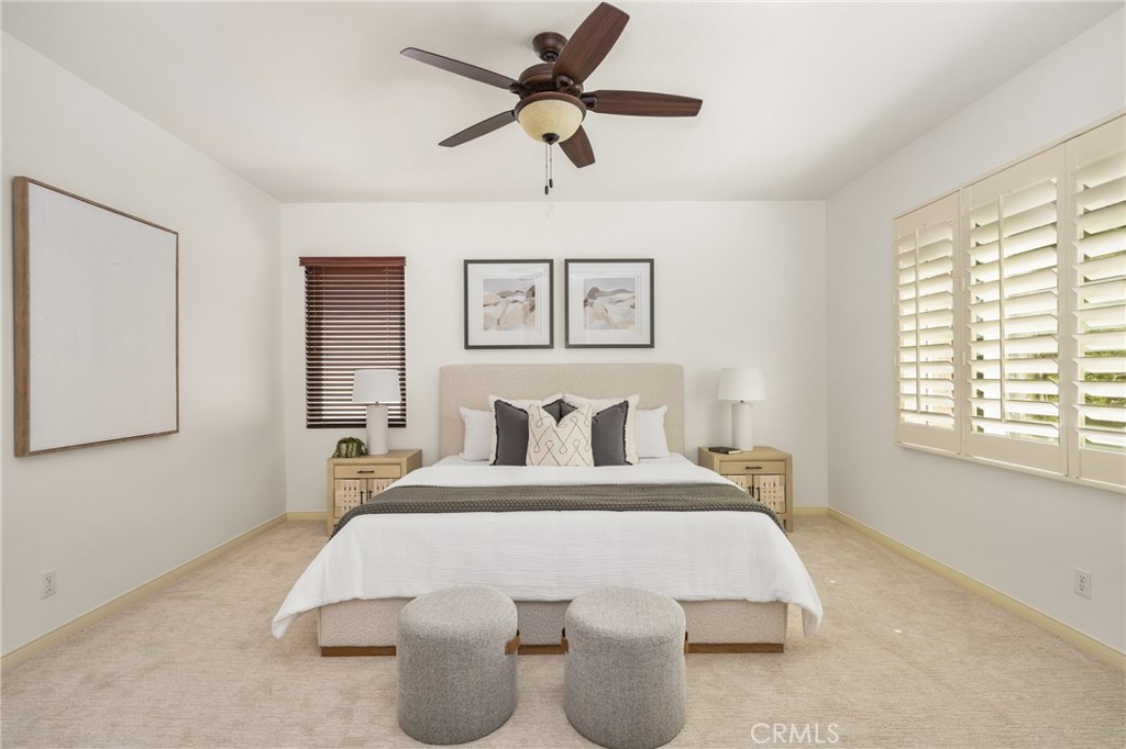 10970 Hiskey Lane Tustin, CA 92782 - Photo 42 of 60 a bedroom with a large bed and a chandelier