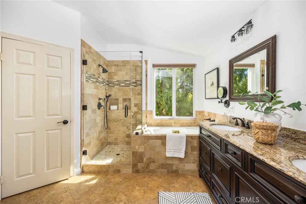 10970 Hiskey Lane Tustin, CA 92782 - Photo 46 of 60 a spacious bathroom with a double vanity sink a mirror and a shower