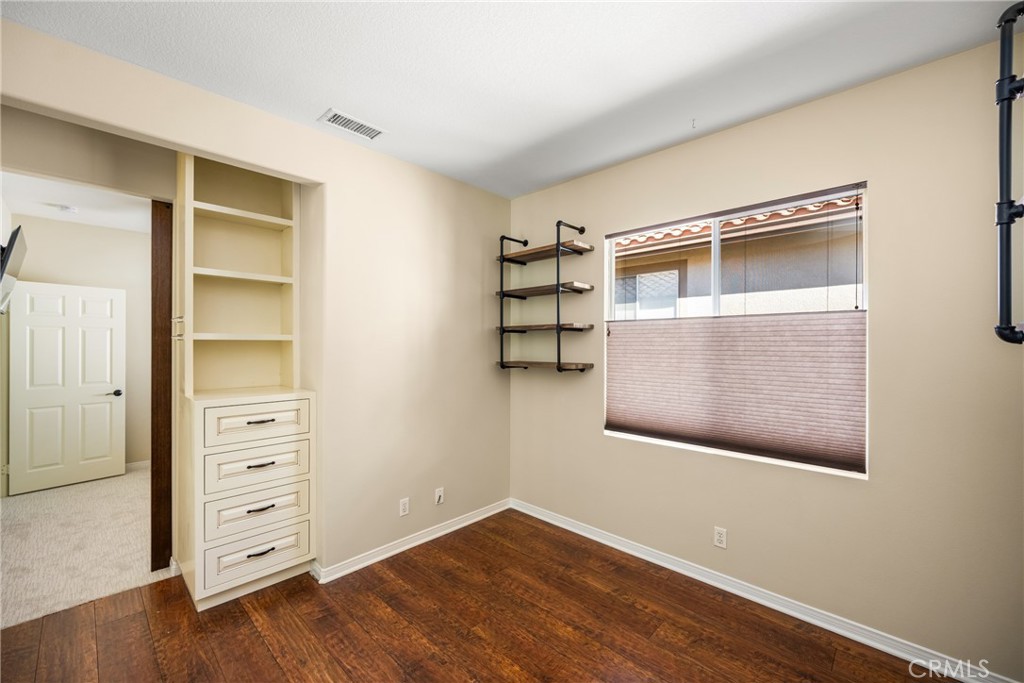 10970 Hiskey Lane Tustin, CA 92782 - Photo 49 of 60 a view of an empty room with wooden floor and closet