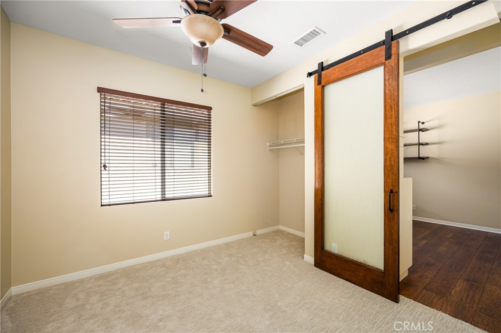 10970 Hiskey Lane Tustin, CA 92782 - Photo 50 of 60 a view of an empty room with wooden floor and a window