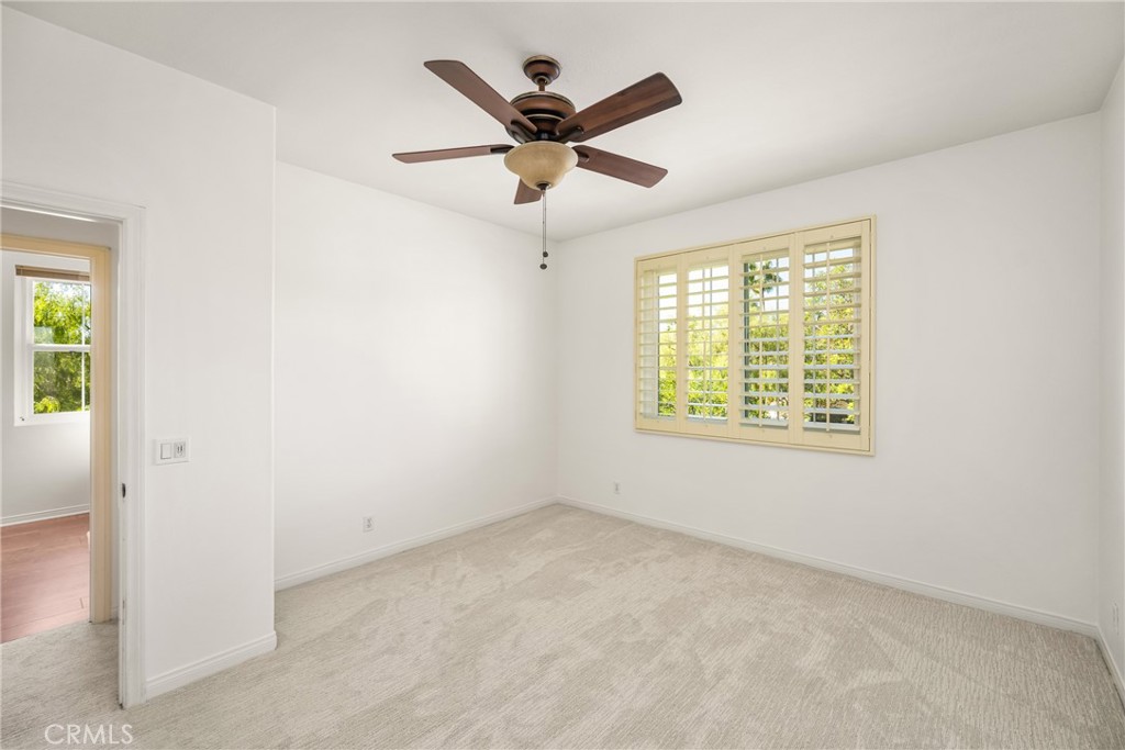 10970 Hiskey Lane Tustin, CA 92782 - Photo 54 of 60 an empty room with ceiling fan and window