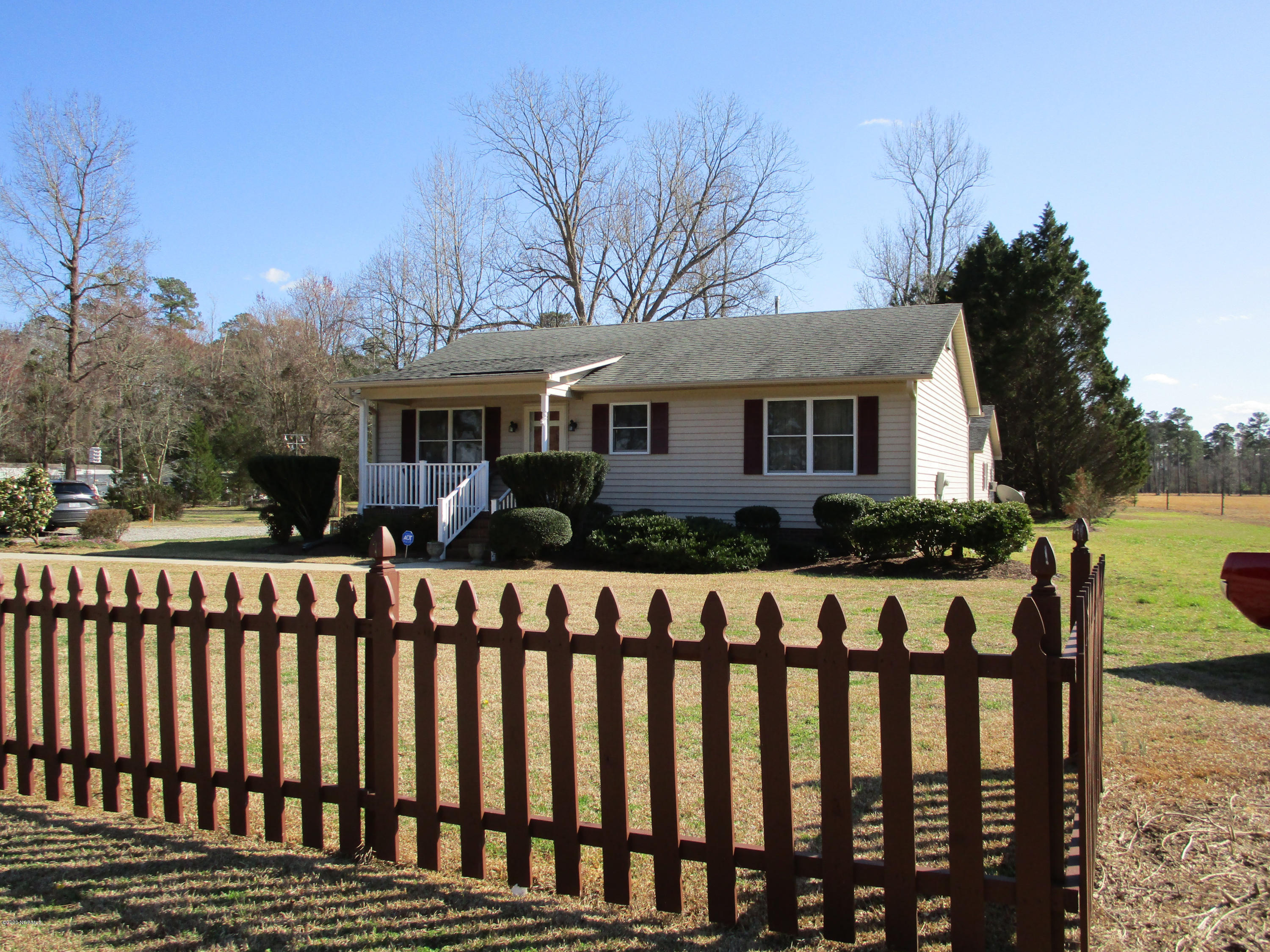 3854 Mobleys Bridge Road Grimesland, NC 27837 - Photo 1 of 15 Darling Farmhouse 2 Bed Rooms & 2 Baths located on almost an Acre & Half Wood Lot, Garden Space, Detached Double Carport & Huge Workshop