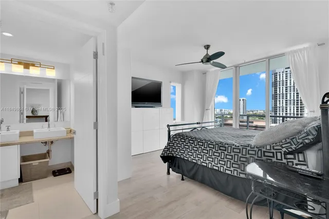 a living room with a couch and a chandelier
