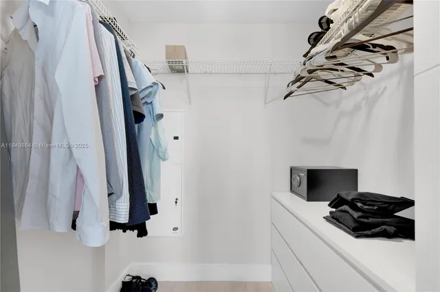 a view of a closet and a shower curtain