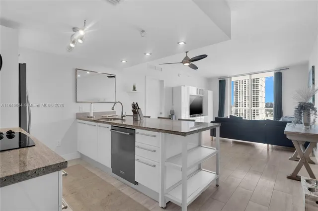a kitchen with counter top space and sink