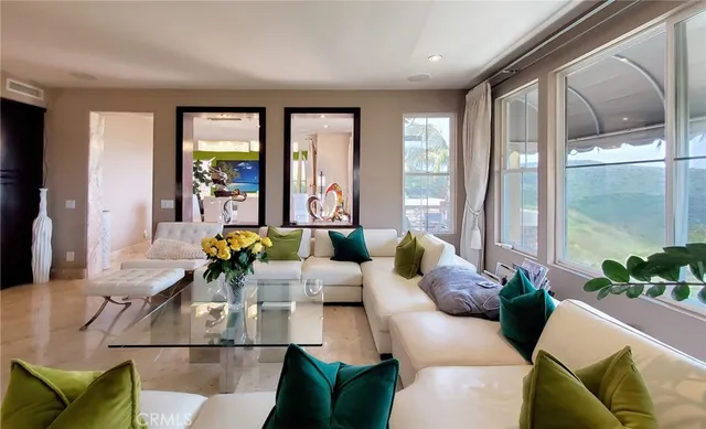 a living room with furniture fireplace and flat screen tv
