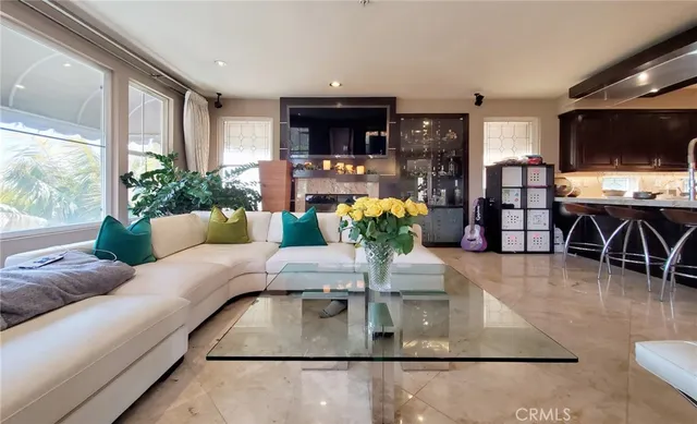 a view of hallway with livingroom and furniture