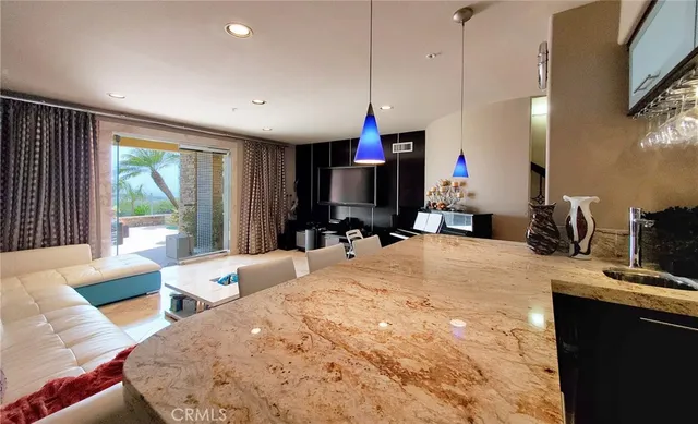 a living room with furniture and white walls